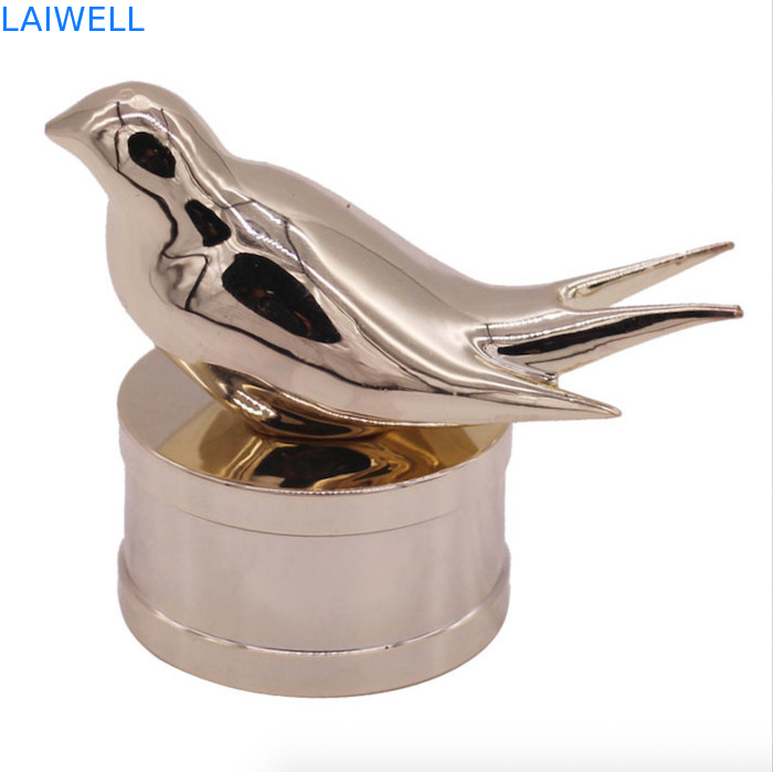 Bouchons de flacon de parfum en alliage de zinc modernes et tendance avec un design d'oiseau personnalisé pour les parfums haut de gamme